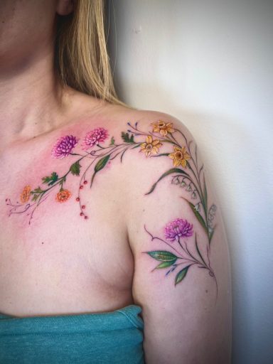 Colour floral shoulder and collarbone tattoo with wild flowers by Lena Luna Tattoo, UK